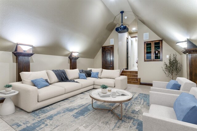 6620 Cedar Grove Dr, North Richland Hills, TX 76182 - carpeted home theater room featuring vaulted ceiling, visible vents, and baseboards