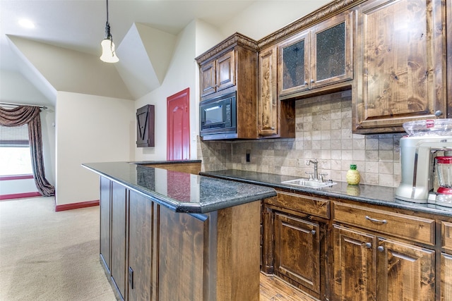 6620 Cedar Grove Dr, North Richland Hills, TX 76182 - kitchen featuring a sink, tasteful backsplash, baseboards, pendant lighting, and black microwave