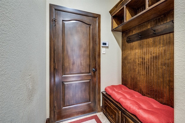 mudroom featuring a textured wall