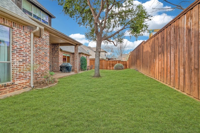 view of yard with a fenced backyard