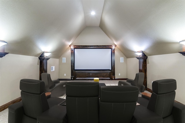 6620 Cedar Grove Dr, North Richland Hills, TX 76182 - carpeted home theater room featuring vaulted ceiling and baseboards