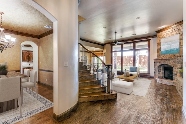 6620 Cedar Grove Dr, North Richland Hills, TX 76182 - staircase with visible vents, arched walkways, and crown molding