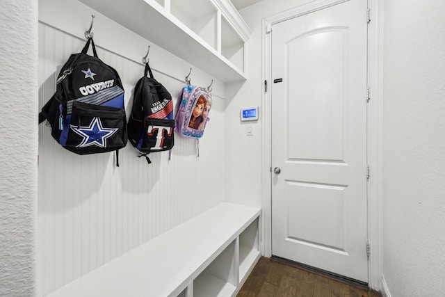 mudroom with dark wood-style flooring