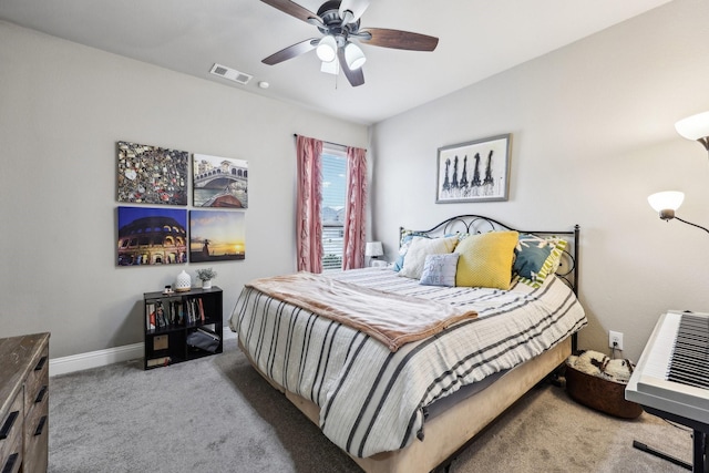 carpeted bedroom featuring visible vents, ceiling fan, and baseboards