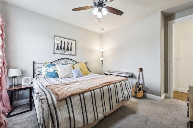 bedroom featuring a ceiling fan, carpet, and baseboards