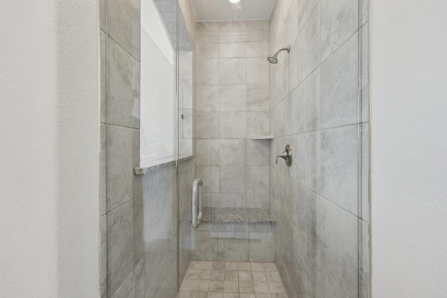 bathroom with a shower stall