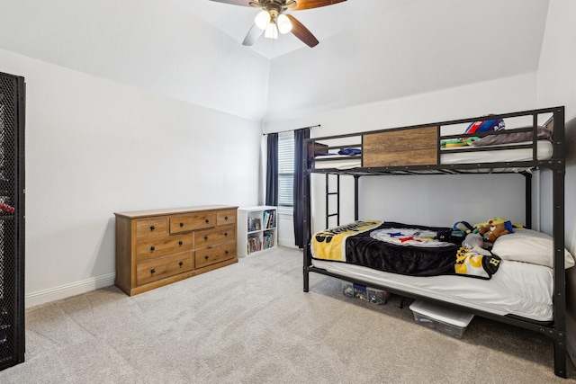 bedroom with baseboards, carpet floors, lofted ceiling, and a ceiling fan