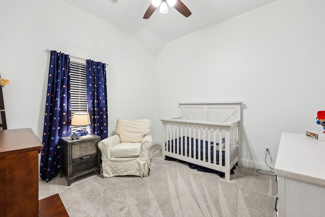 bedroom with baseboards, lofted ceiling, a ceiling fan, and carpet flooring