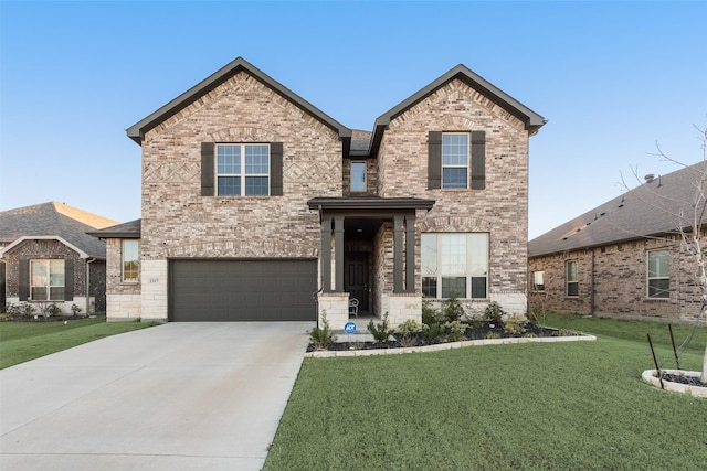 traditional-style house with a garage, a front yard, concrete driveway, and brick siding