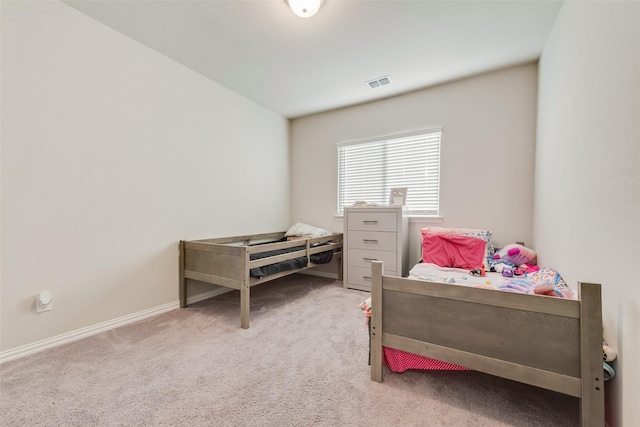 bedroom with visible vents, baseboards, and carpet flooring