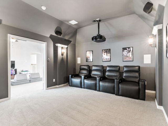 home theater with lofted ceiling, carpet, and baseboards