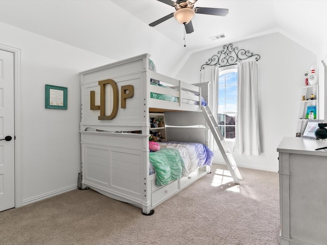 carpeted bedroom with lofted ceiling, a ceiling fan, visible vents, and baseboards