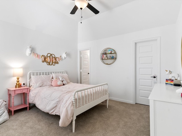 bedroom with light carpet, baseboards, ceiling fan, and vaulted ceiling