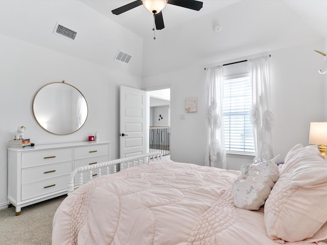 bedroom featuring light carpet, visible vents, a ceiling fan, and vaulted ceiling