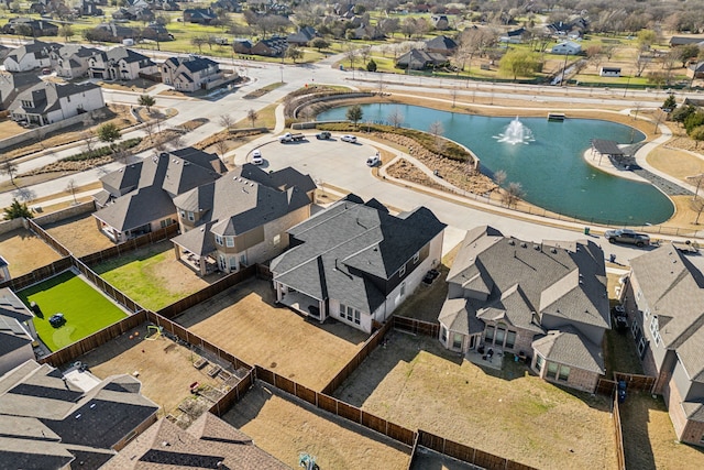 birds eye view of property with a residential view and a water view