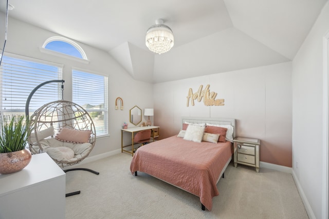 carpeted bedroom featuring lofted ceiling, baseboards, and a chandelier