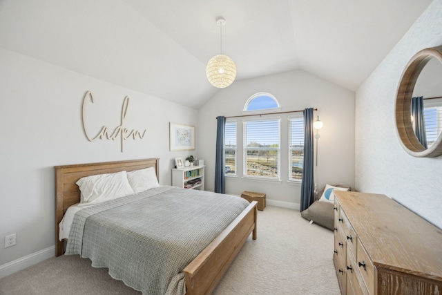 bedroom featuring baseboards, light carpet, and lofted ceiling