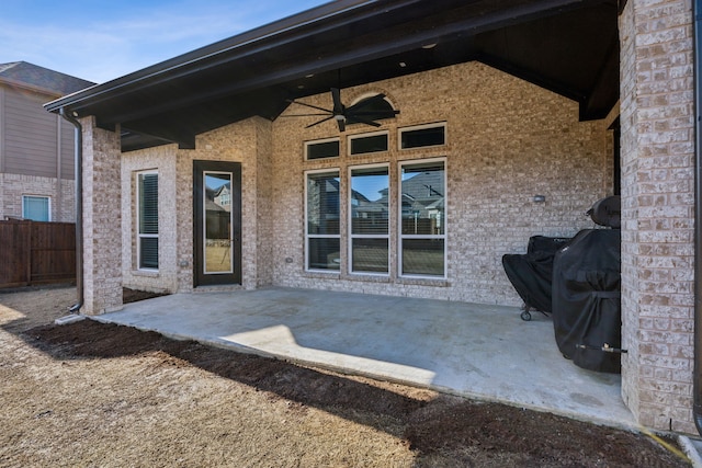 view of patio / terrace featuring ceiling fan and fence