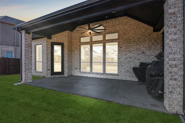 view of patio with a ceiling fan and fence