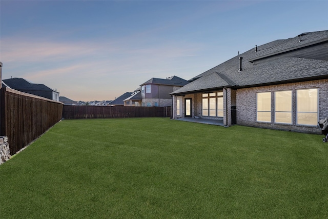 view of yard featuring a fenced backyard and a patio area