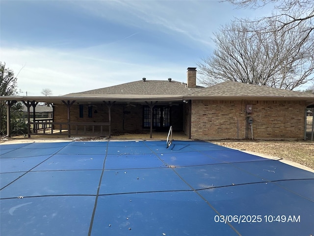 view of pool featuring a covered pool and a patio area