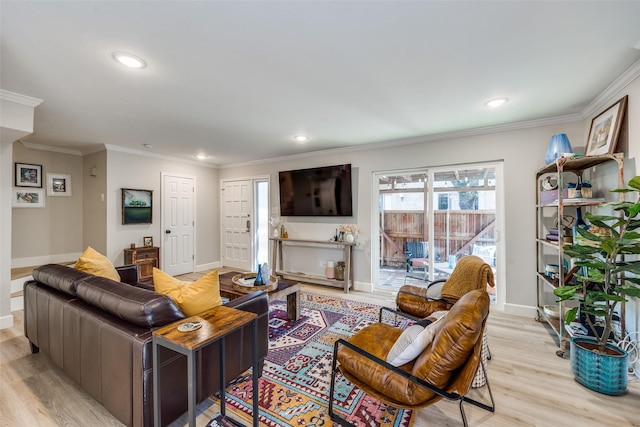 living room with recessed lighting, light wood-style flooring, crown molding, and baseboards