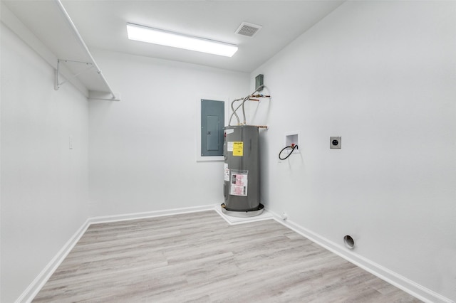 laundry room featuring visible vents, electric water heater, washer hookup, laundry area, and electric dryer hookup