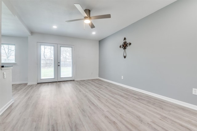 unfurnished living room with light wood-type flooring, french doors, baseboards, and recessed lighting