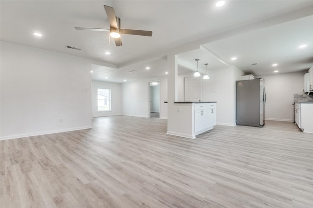 unfurnished living room featuring visible vents, light wood-style flooring, recessed lighting, baseboards, and ceiling fan