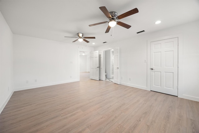 spare room with recessed lighting, visible vents, light wood-style flooring, and baseboards