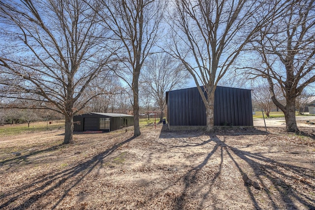 view of yard featuring an outbuilding and a pole building