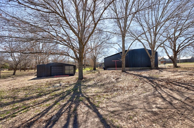 view of yard featuring an outbuilding and an outdoor structure