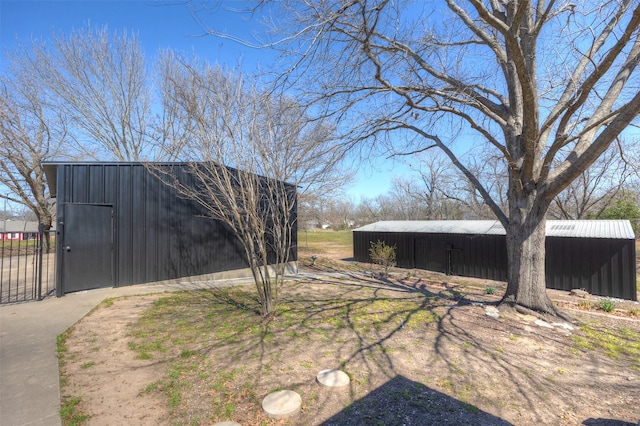 view of yard featuring an outbuilding and an outdoor structure