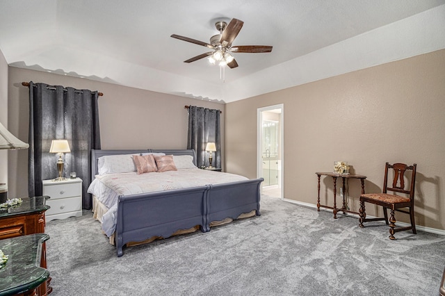 bedroom featuring ensuite bath, carpet, baseboards, and ceiling fan