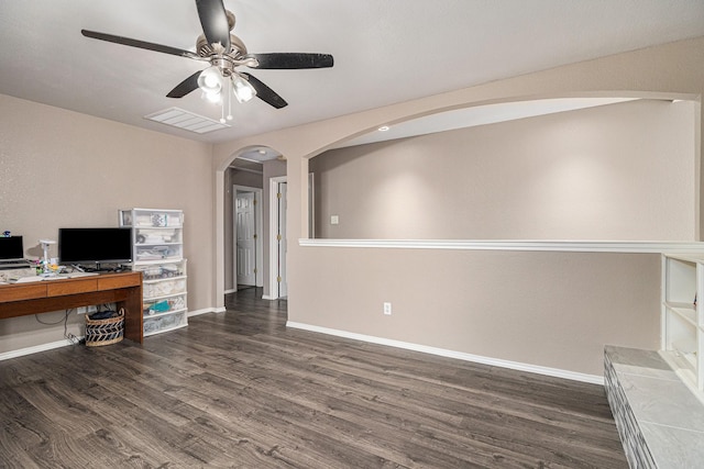 400 Goodnight Trl, Justin, TX 76247 - unfurnished office featuring dark wood-style flooring, ceiling fan, arched walkways, baseboards, and visible vents