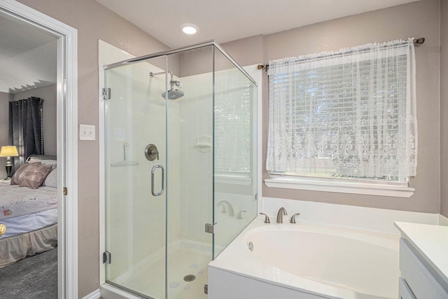 full bathroom featuring recessed lighting, a shower stall, ensuite bathroom, and a garden tub