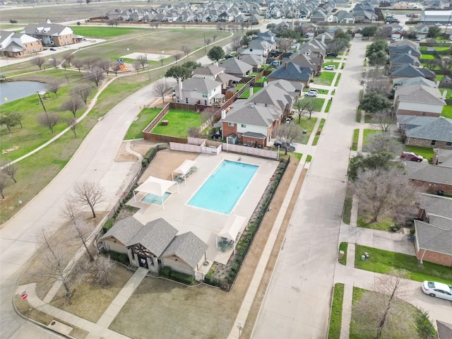 drone / aerial view with a residential view and a water view