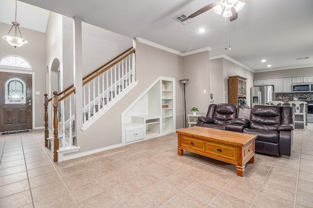 living room featuring visible vents, ornamental molding, recessed lighting, stairway, and arched walkways