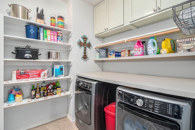 400 Goodnight Trl, Justin, TX 76247 - clothes washing area featuring baseboards, light tile patterned flooring, cabinet space, and washer and dryer