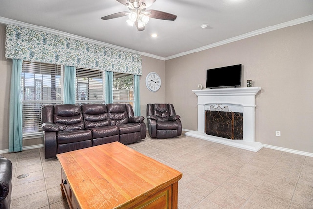 living room featuring light tile patterned floors, baseboards, a fireplace with raised hearth, ceiling fan, and crown molding