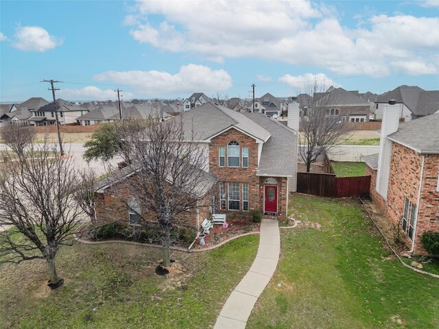 400 Goodnight Trl, Justin, TX 76247 - traditional home featuring a chimney, fence, a residential view, and a front lawn
