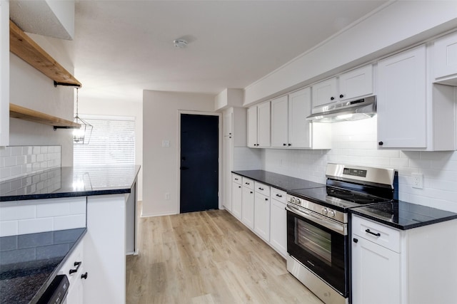 kitchen featuring stainless steel range with electric stovetop, light wood-style flooring, under cabinet range hood, white cabinetry, and decorative backsplash