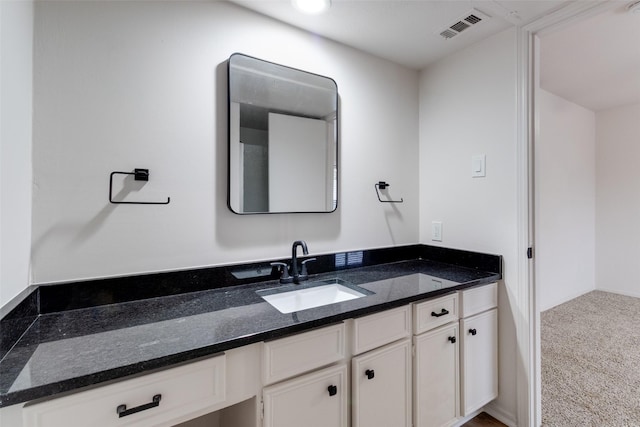 bathroom featuring visible vents and vanity