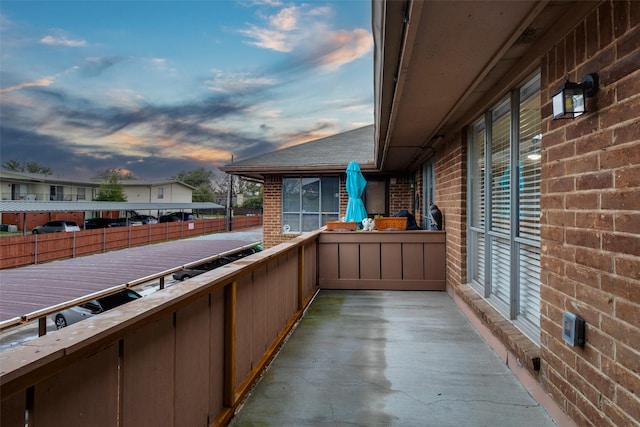 view of patio featuring a balcony