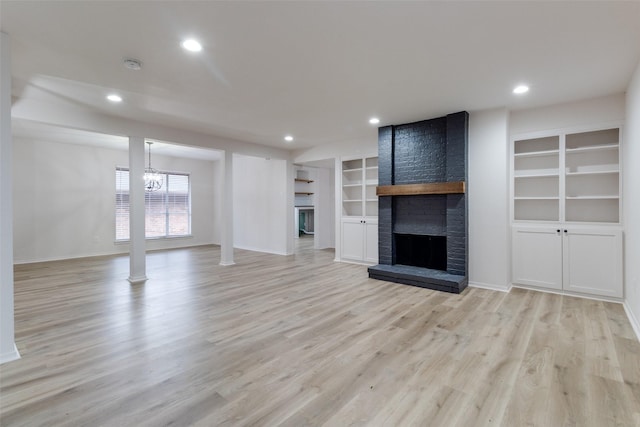 unfurnished living room featuring light wood-style flooring, recessed lighting, a fireplace, and baseboards