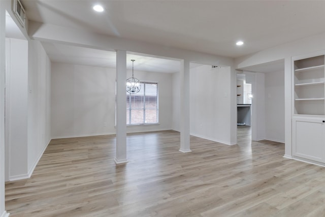 interior space featuring visible vents, baseboards, light wood-style flooring, recessed lighting, and a notable chandelier