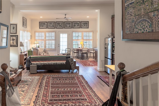 bedroom featuring freestanding refrigerator, wood finished floors, billiards, and ornamental molding