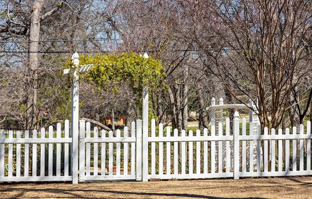 view of gate with fence