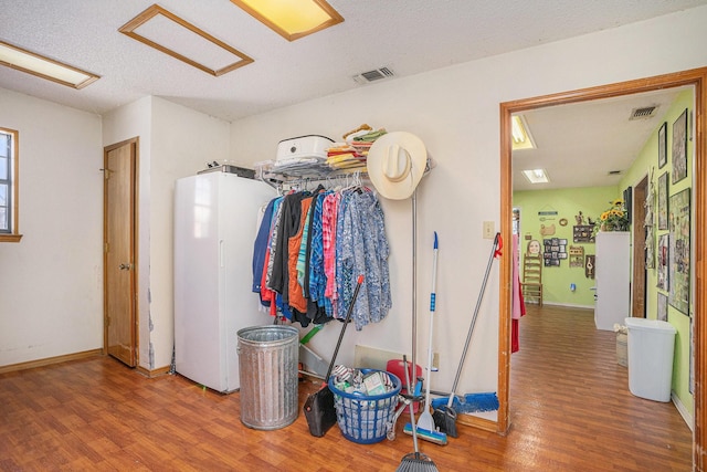 interior space featuring visible vents and wood finished floors