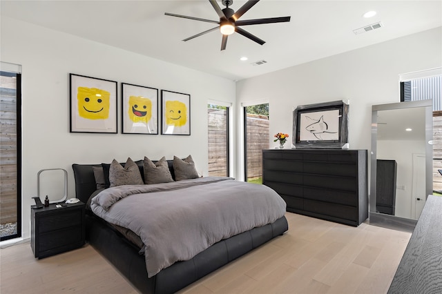 bedroom featuring recessed lighting, visible vents, light wood-style flooring, and a ceiling fan